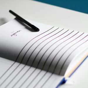 a pen on a notebook. agenda. Digital Marketing, Strategy, Paid Media. Ana Isabel Moura.